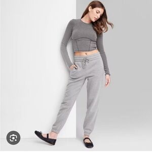 Size XXS new grey joggers with side pockets.